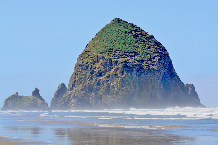 Haystack Rock is a 235-foot (72-meter) sea stack in Cannon Beach