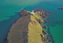 The Start Point lighthouse is located in the South Hams district on the Devon coast, a county in southwestern England