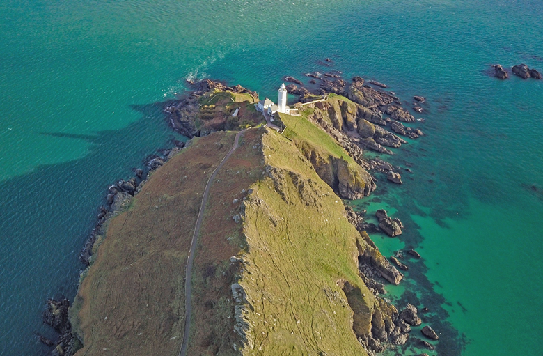 The Start Point lighthouse is located in the South Hams district on the Devon coast, a county in southwestern England
