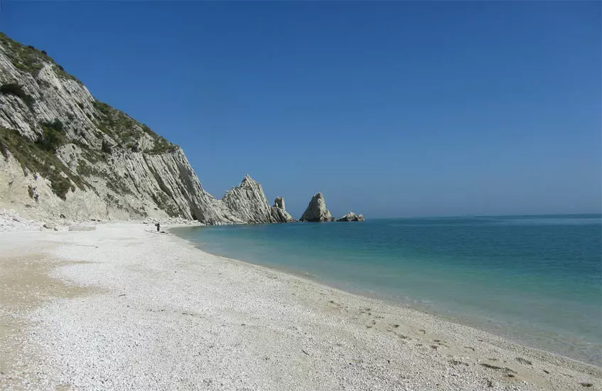 Two twin rocks overlooking the clear waters that caress the Conero Riviera.