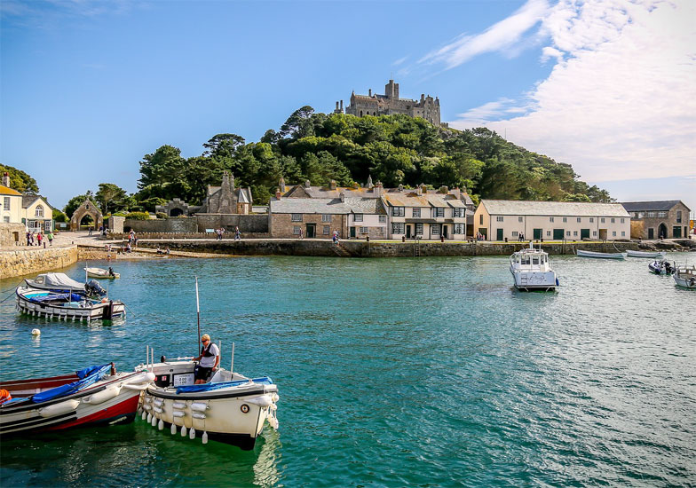 St Michael's Mount is an accessible island at low tide in the shape of a pyramid of granite which rises to 60 m, located in Mount's Bay in Cornwall