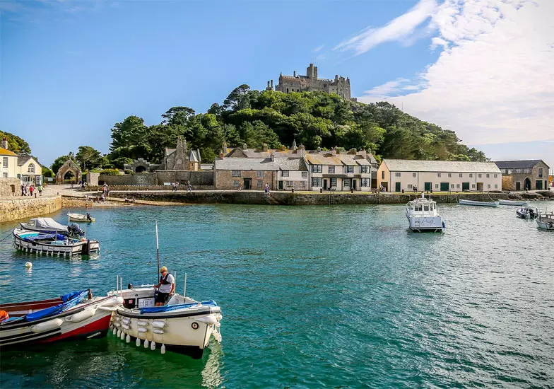 St Michael's Mount is an accessible island at low tide in the shape of a pyramid of granite which rises to 60 m, located in Mount's Bay in Cornwall