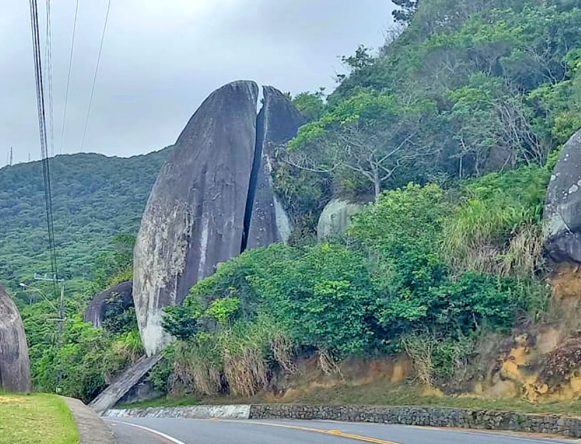 Pedra do Ovo is a a huge egg-shaped rock , A stone split in half , on the Rodesindo Pavan Beach Access Line, Balneário Camboriú, a coast beach city in the southern state of Santa Catarina, Brazil