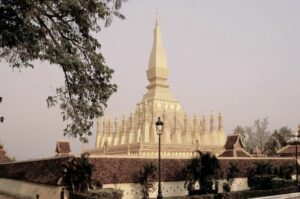 The Pha That Luang is a a gold-covered Buddhist stupa located in Vientiane, the capital and largest city of Laos.