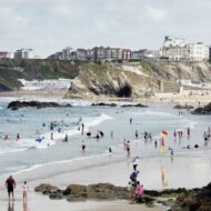 Newquay is a town, seaside resort and fishing port on the north coast of Cornwall , England, United Kingdom.