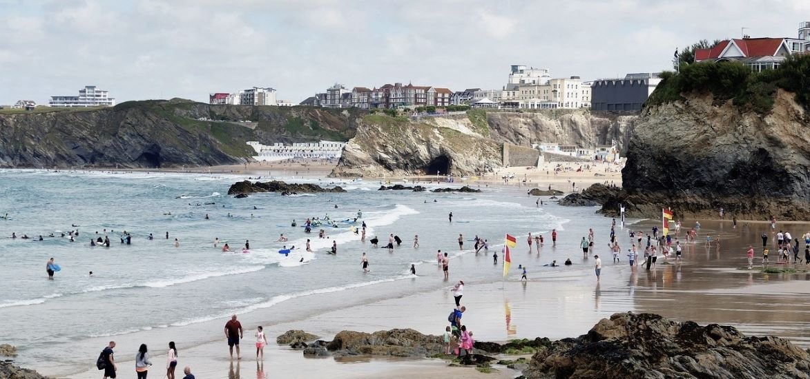 Newquay is a town, seaside resort and fishing port on the north coast of Cornwall , England, United Kingdom.