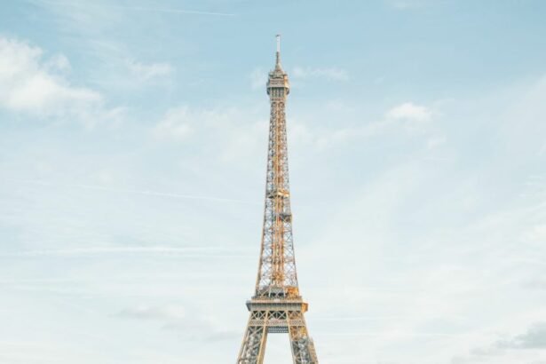 The Eiffel Tower ( Tour Eiffel ) , is a 330 meter high iron truss tower and landmark on the Champ de Mars ,in the city of Paris, France.