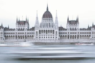 The Hungarian Parliament Building , is the seat of the Hungarian Parliament on the left bank of the Danube in Budapest.