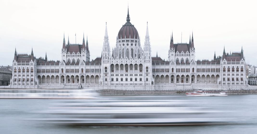 The Hungarian Parliament Building , is the seat of the Hungarian Parliament on the left bank of the Danube in Budapest.