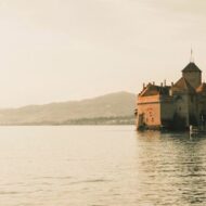 Chillon Castle is a medieval moated castle located on Lake Geneva ,in the canton of Vaud ,in Switzerland.aud ,in Switzerland.