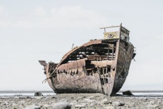 The rusted remains of the Janie Seddon shipwreck located on the Motueka foreshore, Nelson Tasman, New Zealand.