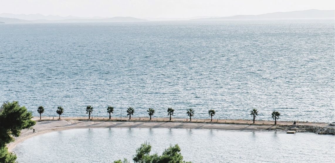 Kasjuni Beach located in the cove of the same name, on the southern part of the Marjan coast. 3 km from the center of Split in Croatia.